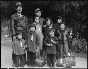 A Dorothea Lange photograph of a Japanese family relocated in 1942