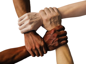 Image of people with different colored skin holding hands