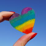 Photo of person holding a rainbow heart