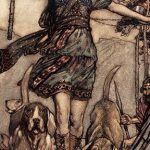 Image of a person walking with two dogs