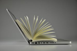 A laptop and a book
