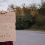 love shouldn't hurt sign