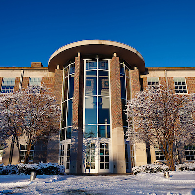 Front facade of upjohn library in winter